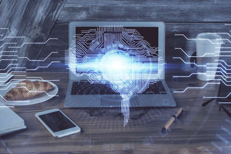 Multi exposure of work table with computer and brain hologram. Brainstorm concept.