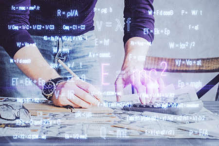 Student or teacher with mathematical and scientific formulas. Concepts of education. Symbols and equations on a virtual interface. Double exposure.の写真素材