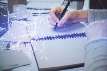 Start up creative drawing over close up hands in notepad background. Concept of brainstorming. Double exposureの写真素材