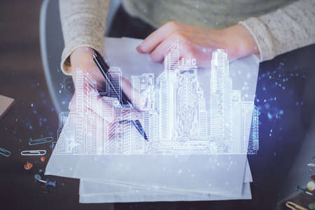 IOT drawing over writing hands in notepad background. Concept of smaert home. Multi exposureの写真素材