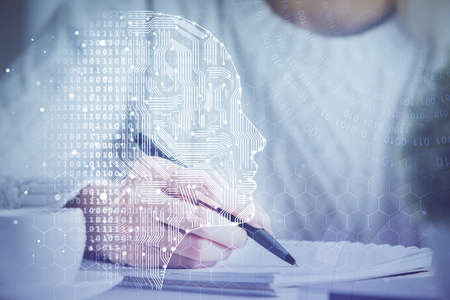 Multi exposure of writing hand on background with brain hologram. Concept of learning.