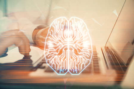 Man typing on keyboard background with brain hologram. Concept of big Data.の写真素材