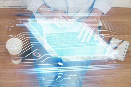Multi exposure of technology hologram with man working on computer background. Concept of big data.