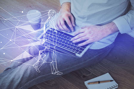 Start up drawings with businessman working on computer on background. Teamwork concept. Double exposure.の写真素材