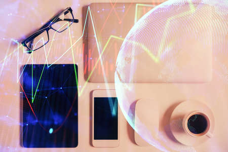 Multi exposure of financial chart hologram over desktop with phone. Top view. Mobile trade platform concept.の写真素材