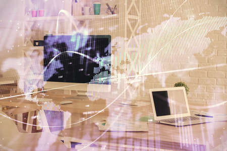Double exposure of financial graph drawing and office interior background. Concept of stock market.の写真素材