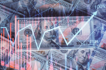 Multi exposure of forex chart drawing over us dollars bill background. Concept of financial success markets.の写真素材
