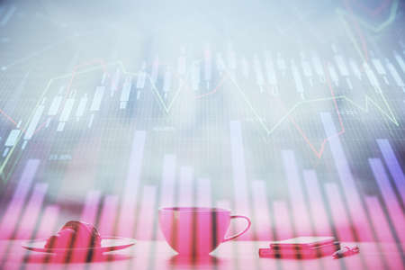 Double exposure of forex chart over coffee cup background in office. Concept of financial analysis and success.の写真素材