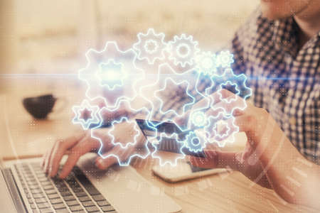 Double exposure of man hands holding a credit card and internet business theme drawing. Digital fintech and E-commerce concept.の写真素材