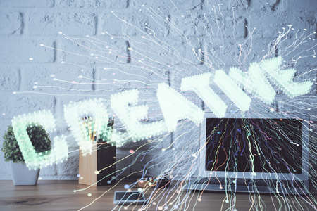 Desktop computer background in office and start up theme hologram drawing. Double exposure. Startup...