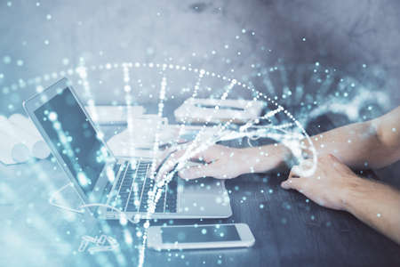 DNA hologram with businessman working on computer on background. Concept of bioengineering. Double...