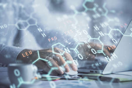 Science formula hologram with man working on computer on background. Education concept. Double exposure.の写真素材