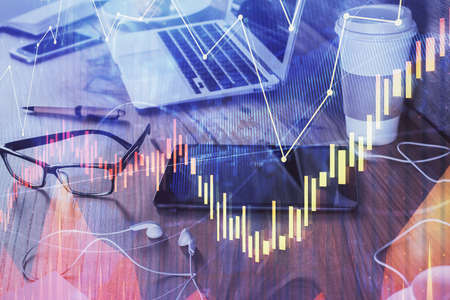 Double exposure of forex chart drawing and cell phone background. Concept of financial trading