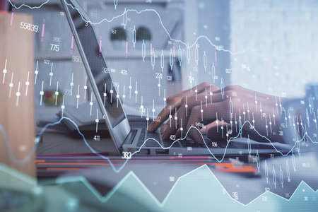 Double exposure of woman hands typing on computer and forex chart hologram drawing. Stock market...