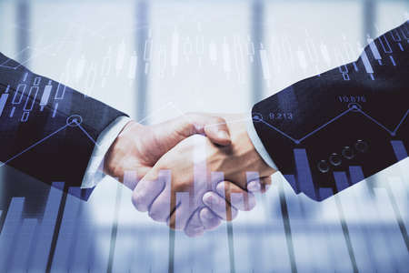 Double exposure of forex graph hologram and handshake of two men. Stock market concept.