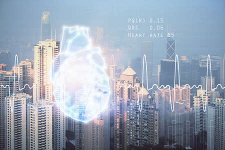 Double exposure of heart icon and cityscape background.