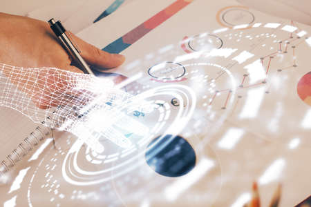 Writing mans hands background with technology huds. Double exposure. Concept data.の写真素材