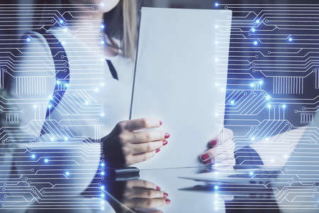 Technology theme hologram over womans hands taking notes background. Concept of Tech. Double...