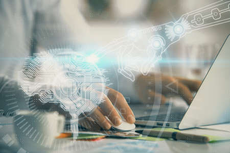 Man typing on keyboard background with brain hologram. Concept of big Data.