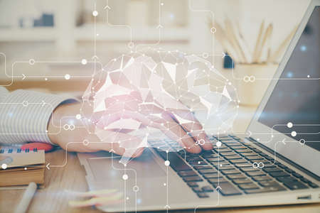 Man typing on keyboard background with brain hologram. Concept of big Data. Double exposure.