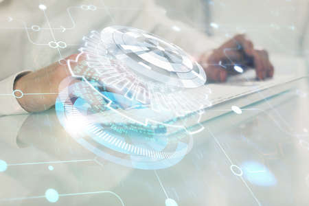 Multi exposure of tech drawings with man working on computer background. Concept of innovation.