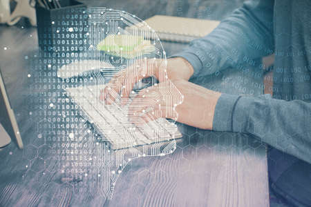 Man with computer background with brain theme hologram. Concept of brainstorm. Double exposure.の写真素材