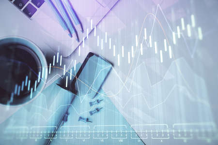 Double exposure of forex graph drawing over desktop background with computer. Concept of financial...