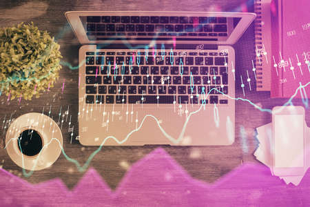 Stock market chart and top view computer on the table background. Multi exposure. Concept of financial analysis.の写真素材