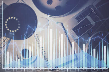 Multi exposure of forex chart drawing and work table top veiw. Concept of financial analysis.