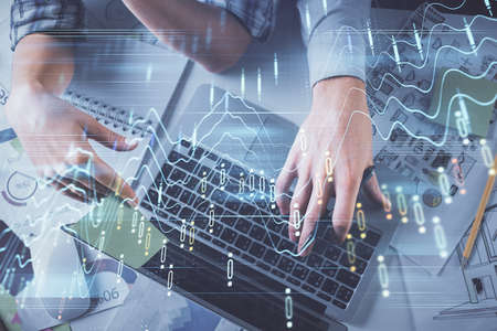 Double exposure of man and woman working together and forex graph hologram drawing. Financial...