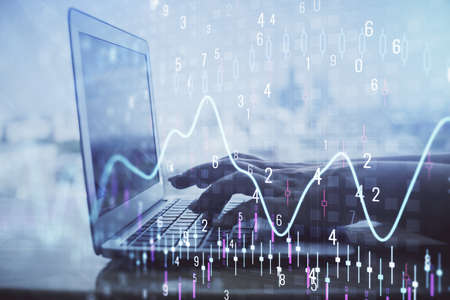 Double exposure of woman hands typing on computer and forex chart hologram drawing. Stock market analysis concept.の写真素材