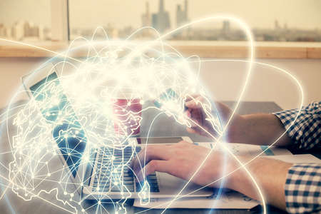Double exposure of man hands holding a credit card and internet business theme drawing. Digital...