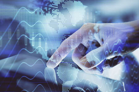 Multi exposure of mans hands holding and using a digital phone and forex graph drawing. Financial...
