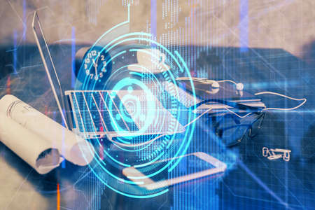 Double exposure of table with computer on background and data theme drawing. Concept of innovation.