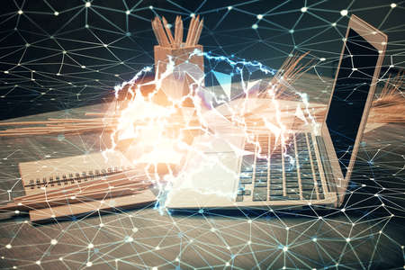 Double exposure of desktop with computer and brain drawing hologram. Artificial intelligence...