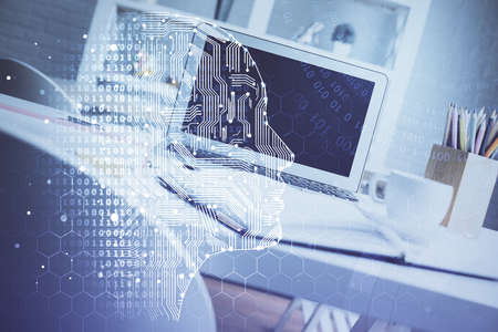 Double exposure of work space with computer and human brain drawing hologram. Brainstorm concept.