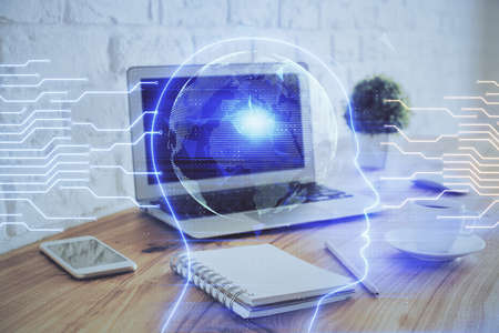 Multi exposure of work space with computer and human brain hologram. Brainstorm concept.