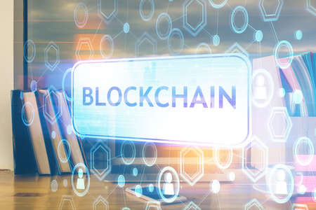 Multi exposure of blockchain theme hologram and table with computer background. Concept of bitcoin...