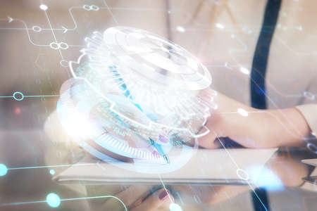 Multi exposure of womans writing hand on background with data technology hud. Big data concept.の写真素材