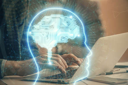 Man typing on keyboard background with brain hologram. Concept of big Data.の写真素材