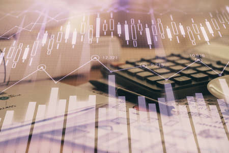 Double exposure of financial chart drawings and desk with open notebook background. Concept of forex...