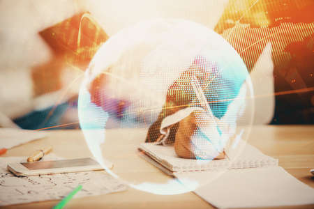 Double exposure of business theme drawing over people taking notes background. Concept of financial worldの写真素材