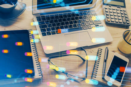 Double exposure of table with computer on background and data theme drawing. Concept of innovation.