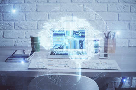 Multi exposure of work space with computer and human brain hologram. Brainstorm concept.