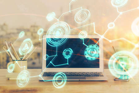 Computer on desktop with social network hologram. Multi exposure. Concept of international people connections.の写真素材
