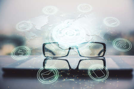 Social network theme drawing with glasses on the table background. Concept of people media connection. Double exposure.の写真素材