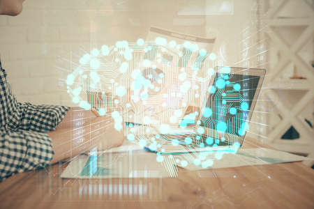 Man typing on keyboard background with brain hologram. Concept of big Data. Double exposure.