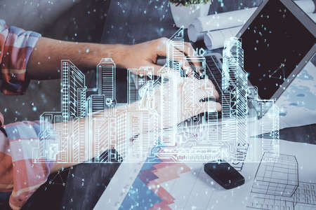 High tech city drawing with businessman working on computer on background. Smartcity concept. Double...