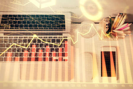 Multi exposure of forex graph drawing over desktop background with computer. Concept of financial...