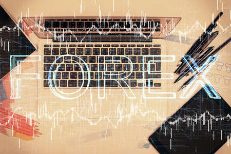 Multi exposure of forex chart drawing over table background with computer. Concept of financial research and analysis. Top view.の写真素材